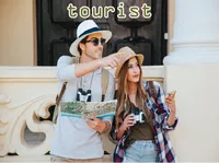 Definition & pronunciation of tourist